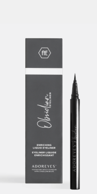 The Adoreye Obsidian bottle open displaying the unique angled-tip applicator with product box on a soft light grey background